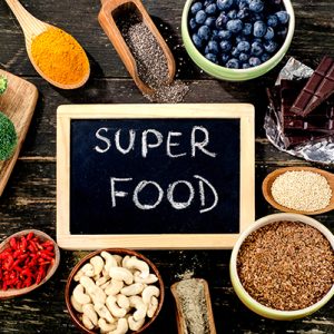 Super foods on rustic wooden background. Top view
